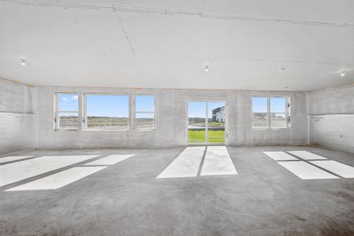 A bright walk-out basement offers endless possibilities- Home under construction, photo of similar home, selections vary
