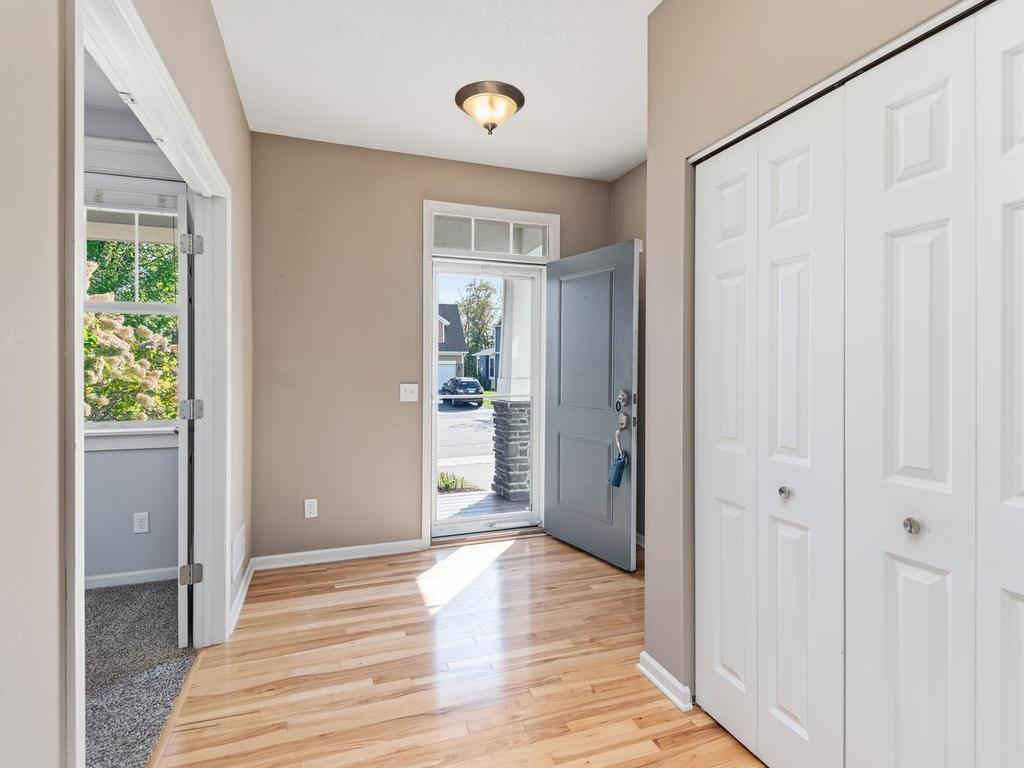 Bright south facing entry, storm door, large closet and access to MF den/office