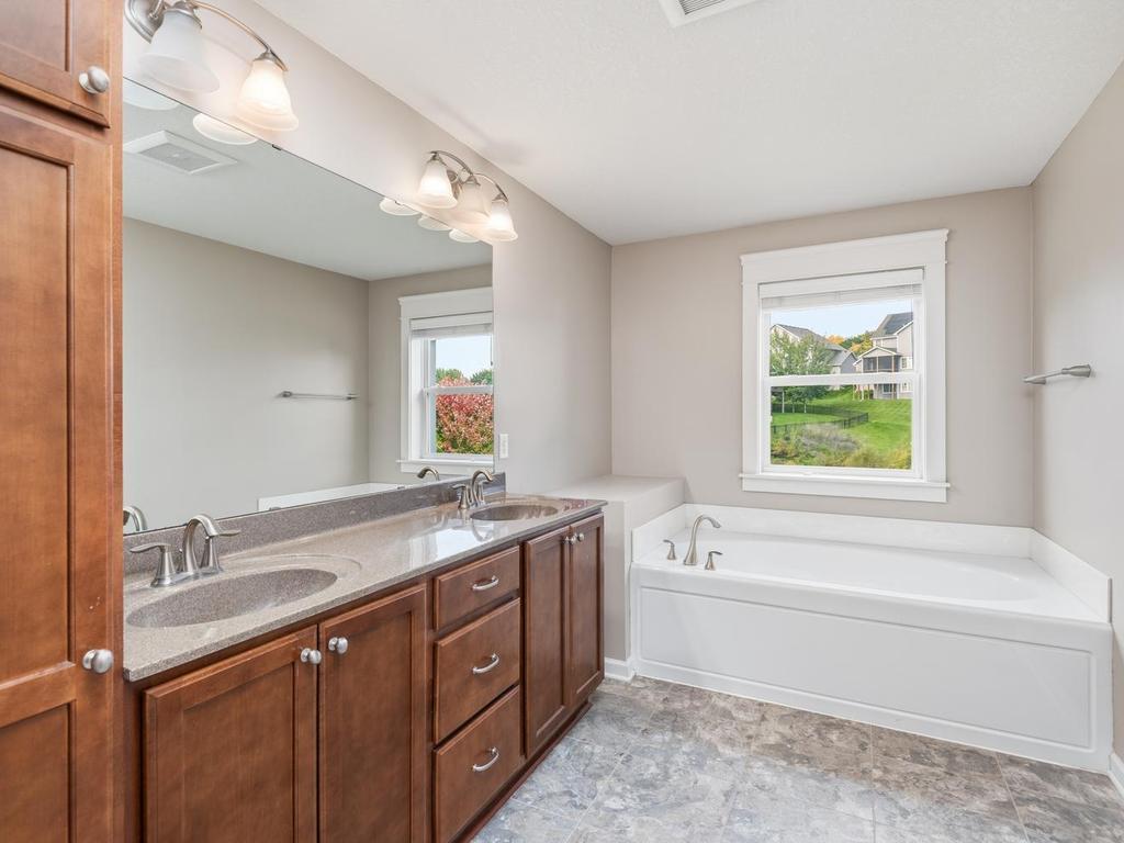 Double sinks, good storage and soaking tub!