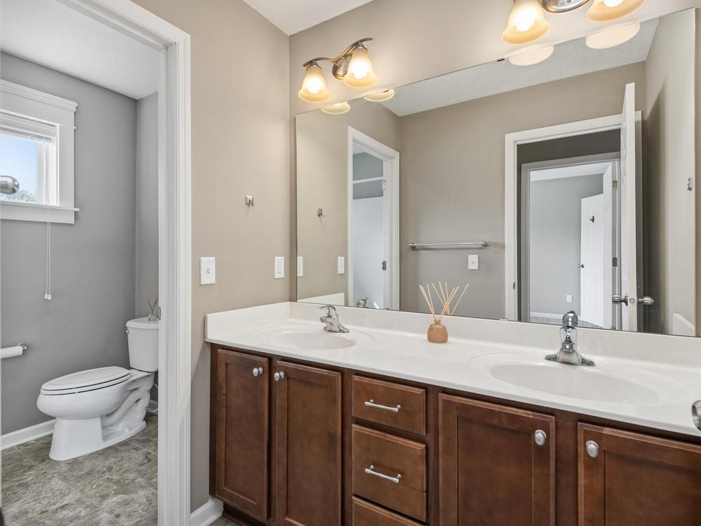 Upper level full bath with double sinks and seperate shower/stool area!