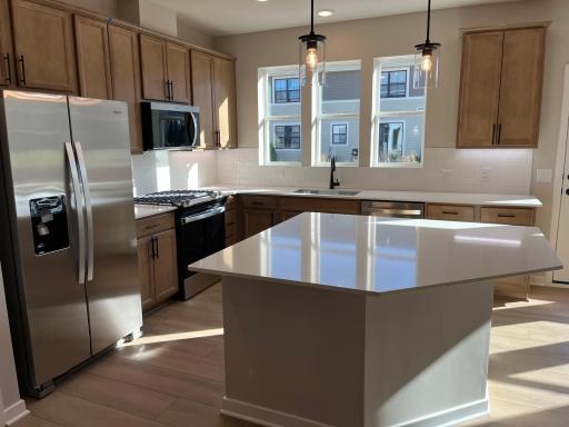 Windows above the kitchen sink and large center island