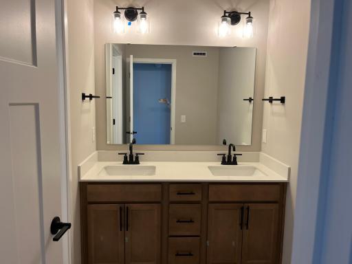 Double vanity in secondary bathroom with separate shower room
