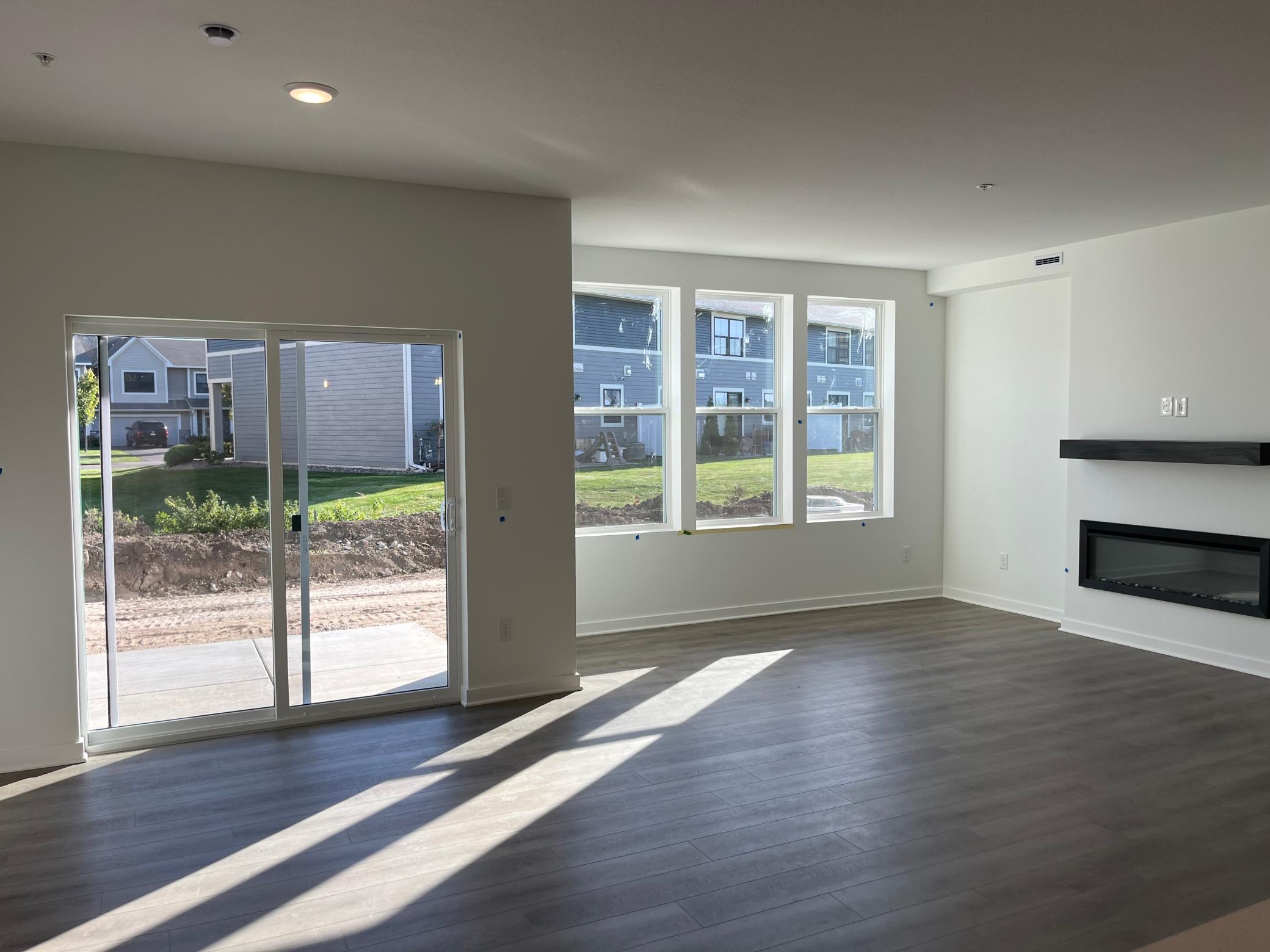 Living space with electric fireplace and outdoor patio