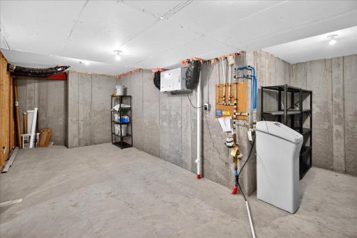 Generous unfinished storage and utility space provides valuable room for seasonal items, household storage, tools, and more.