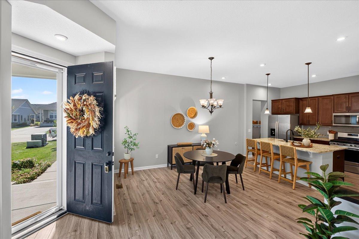 Step into a bright, open-concept main level featuring attractive flooring, neutral finishes, and an easy flow between the kitchen, dining, and living spaces.