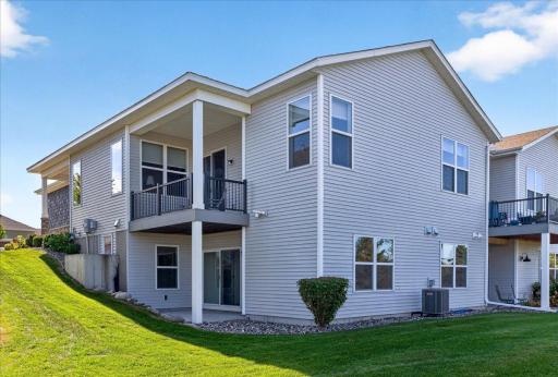 Enjoy your private covered deck overlooking the landscaped green space that is association maintained, with a walkout lower level and patio below.