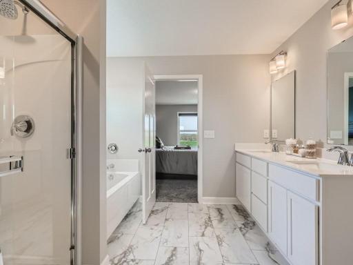 Photo is of the actual home. Separate soaking tub to relax after those long days.