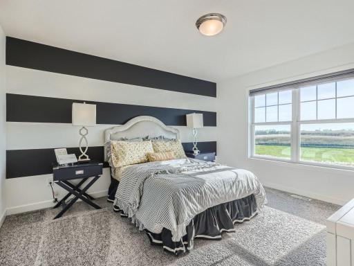 Photo is of the actual home. Very spacious upper level guest bedrooms and only steps away from the loft.