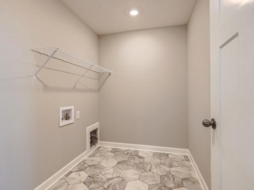 Photo is of the actual home. Enjoy upper level laundry!