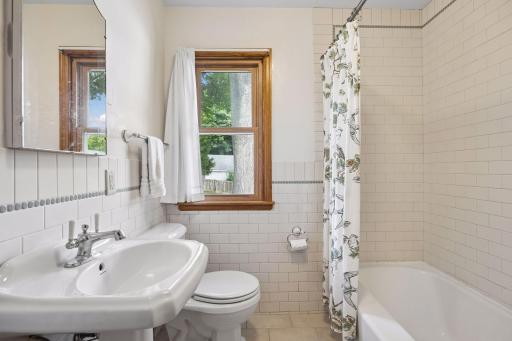 The full bathroom has been updated with classic subway tile.