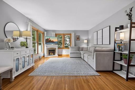 Step inside to discover an open floor plan with original hardwood floors and a spacious, sun-filled family room.