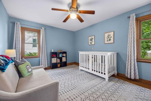 The second main level bedroom overlooks the backyard.