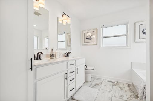 Private primary bathroom featuring a clean, modern design and thoughtful finishes for a comfortable everyday retreat. *Photo of Actual Home