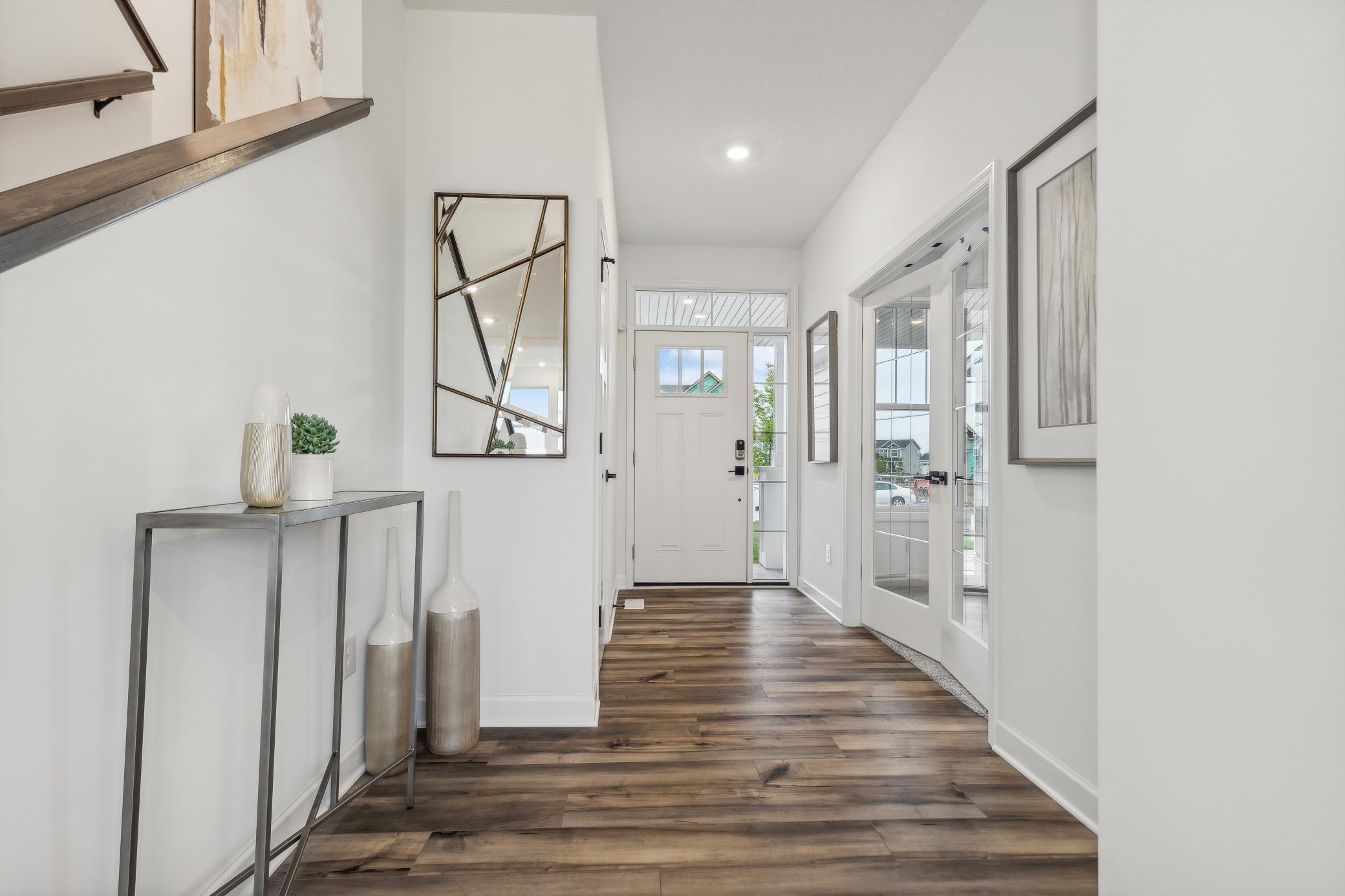 Welcoming foyer creates a beautiful first impression with a bright, open feel and easy access to the main living spaces. *Photo of Actual Home