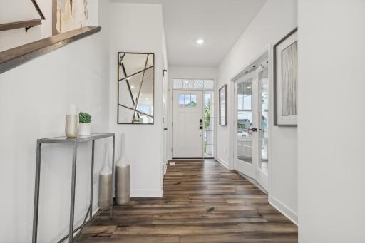 Welcoming foyer creates a beautiful first impression with a bright, open feel and easy access to the main living spaces. *Photo of Actual Home