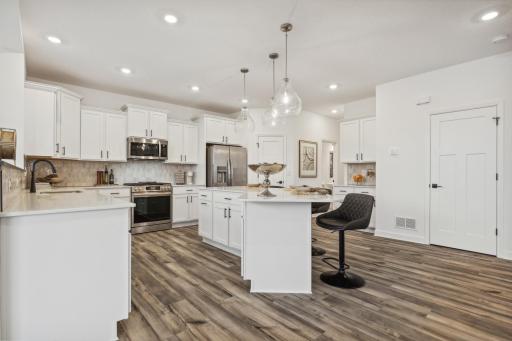Inviting kitchen featuring a large center island, sleek finishes, and plenty of space to prepare and enjoy meals. *Photo of Actual Home