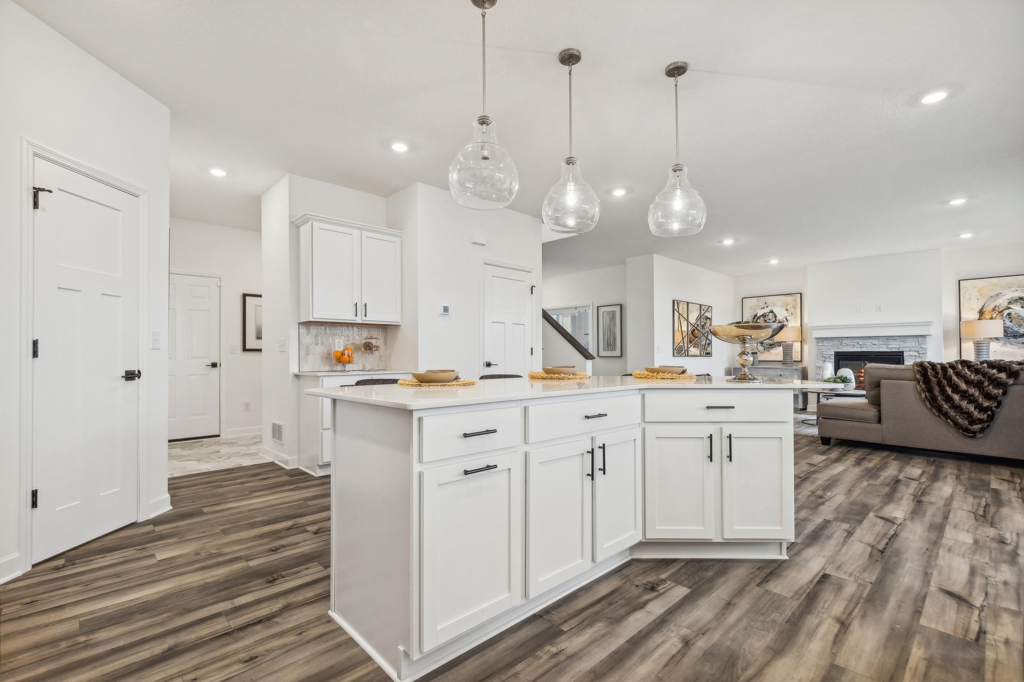 Beautiful kitchen designed with both everyday living and entertaining in mind, offering ample counter space and thoughtful storage. *Photo of Actual Home
