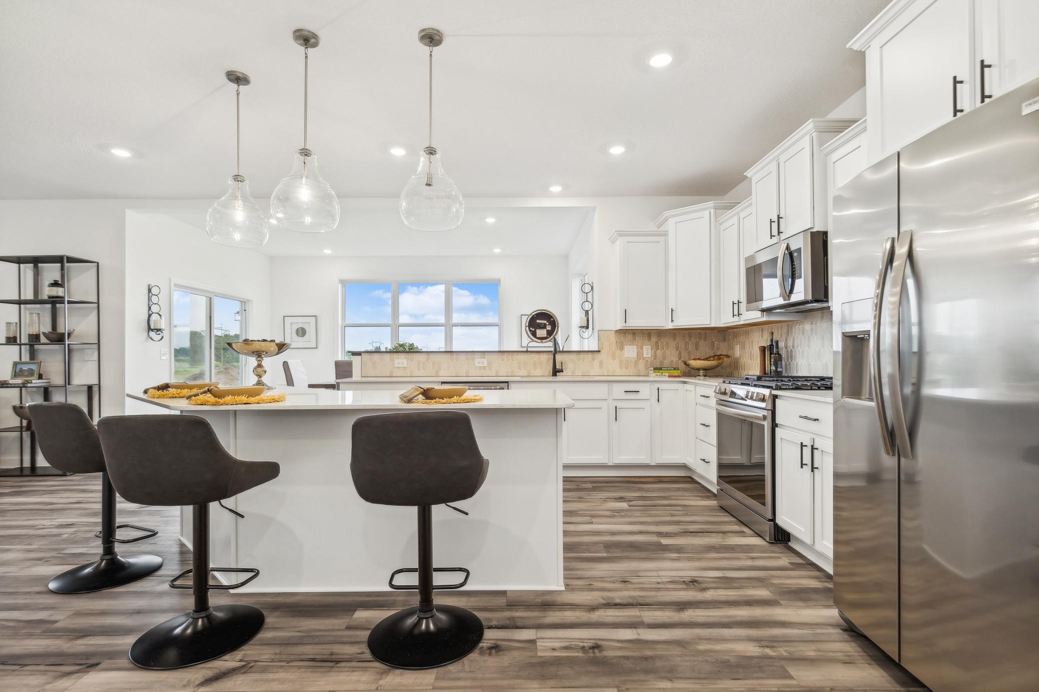 Stylish and functional kitchen featuring modern finishes, generous cabinetry, and a spacious island perfect for gathering. *Photo of Actual Home