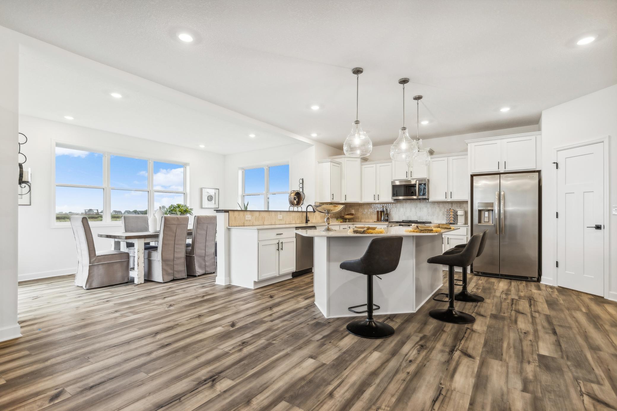 Well-designed kitchen offering the perfect combination of style and functionality, with generous cabinetry, expansive countertops, and a spacious island. *Photo of Actual Home