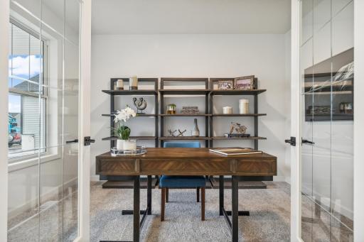 Convenient main-level office providing a dedicated workspace for working from home, studying, or creating a flexible space to fit your needs! *Photo of Actual Home