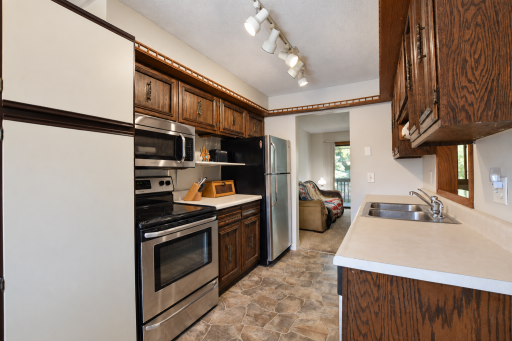Bright neutral kitchen with stainless appliances