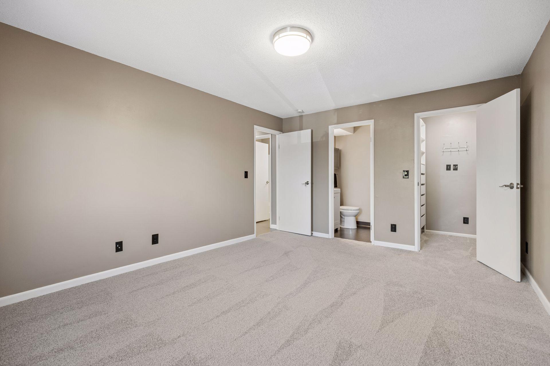 Walk-in closet and en-suit bath in the primary