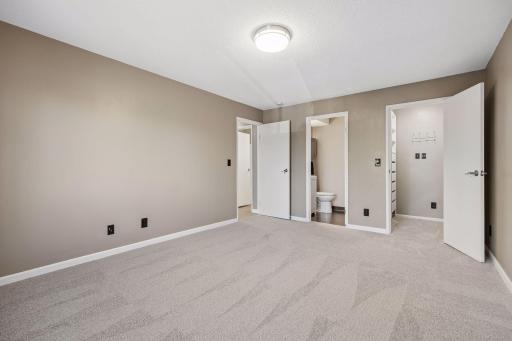 Walk-in closet and en-suit bath in the primary