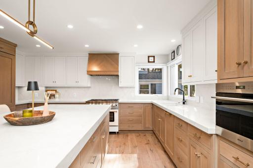 Cerused white oak cabinets on island and lowers