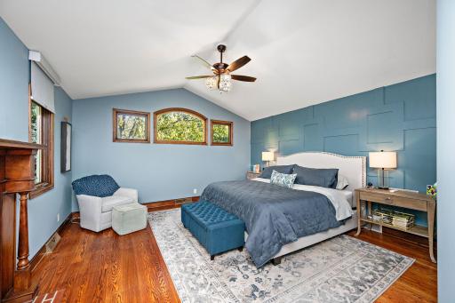 Serene primary bedroom with original oak flooring