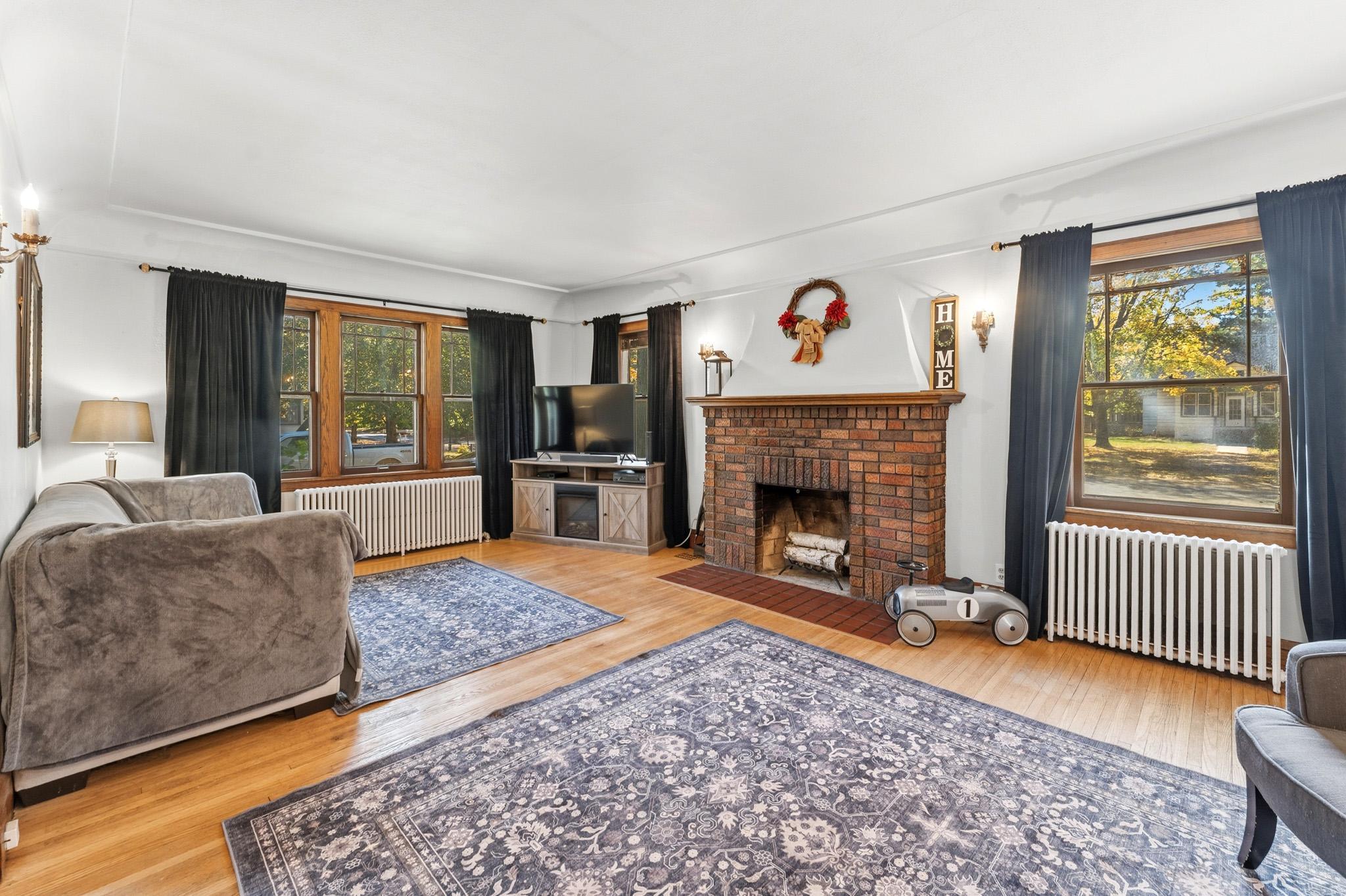 Original details throughout, including the wood-burning fireplace