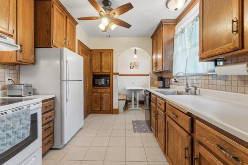 Full height cabinets offer ample counter space. The breakfast nook adds whimsy and a great place to chat.