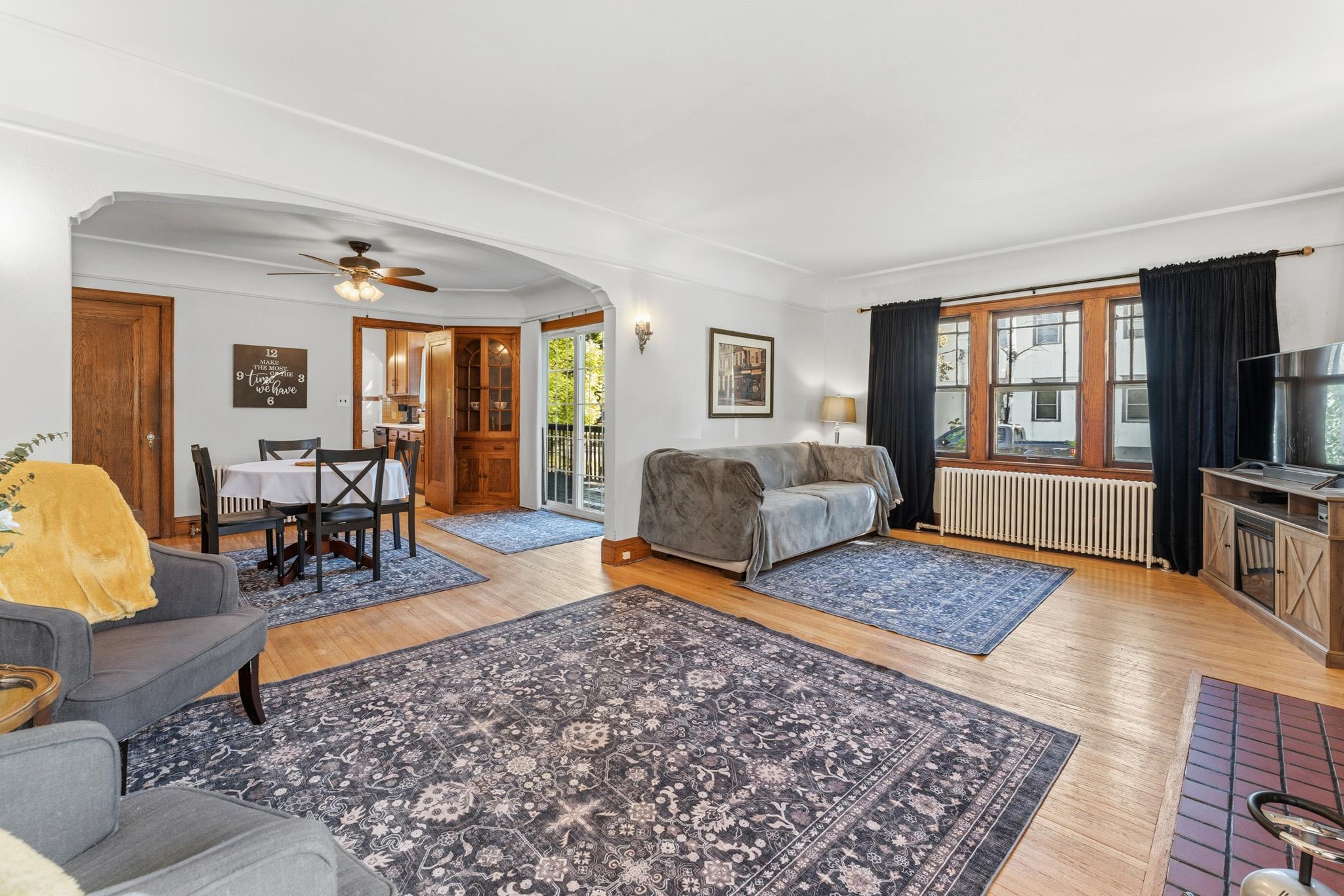 Spacious living spaces with original hardwood floors