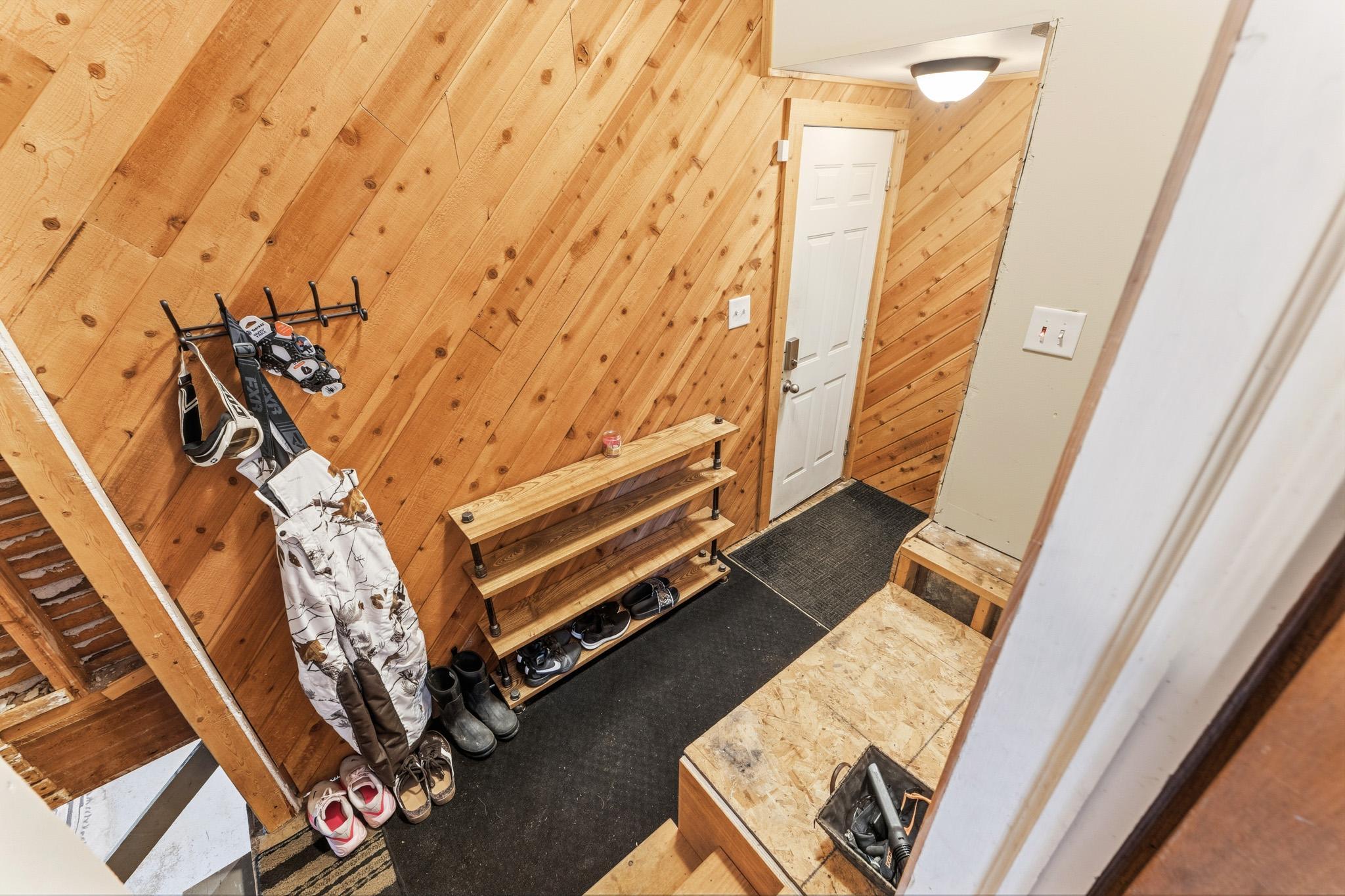 Mud room off kitchen leads to basement, garage and back yard.