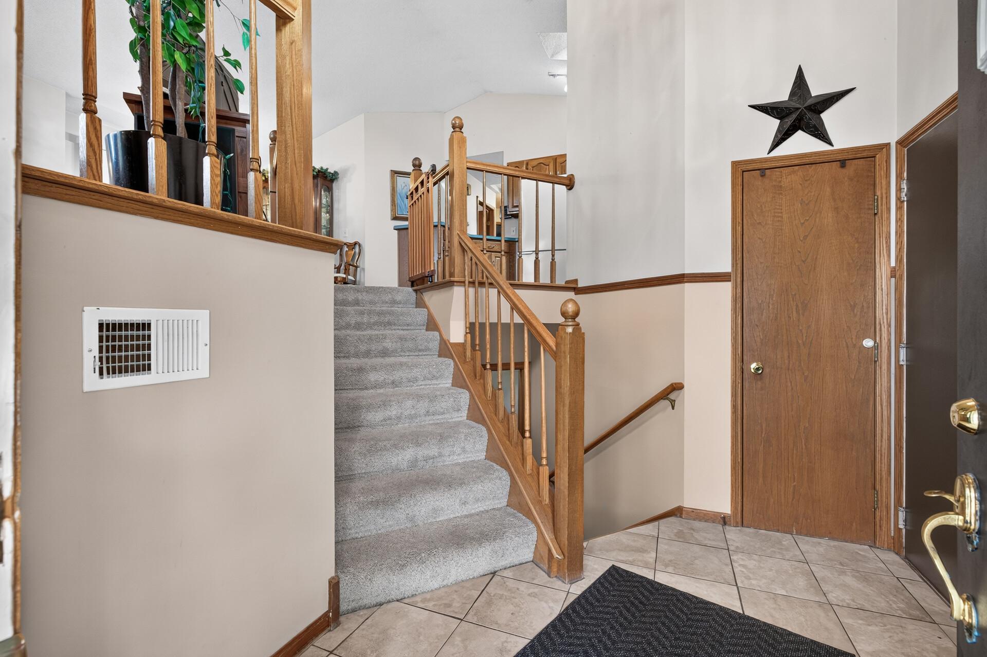 Not your typical split entry floorplan. Welcoming space and angled staircase