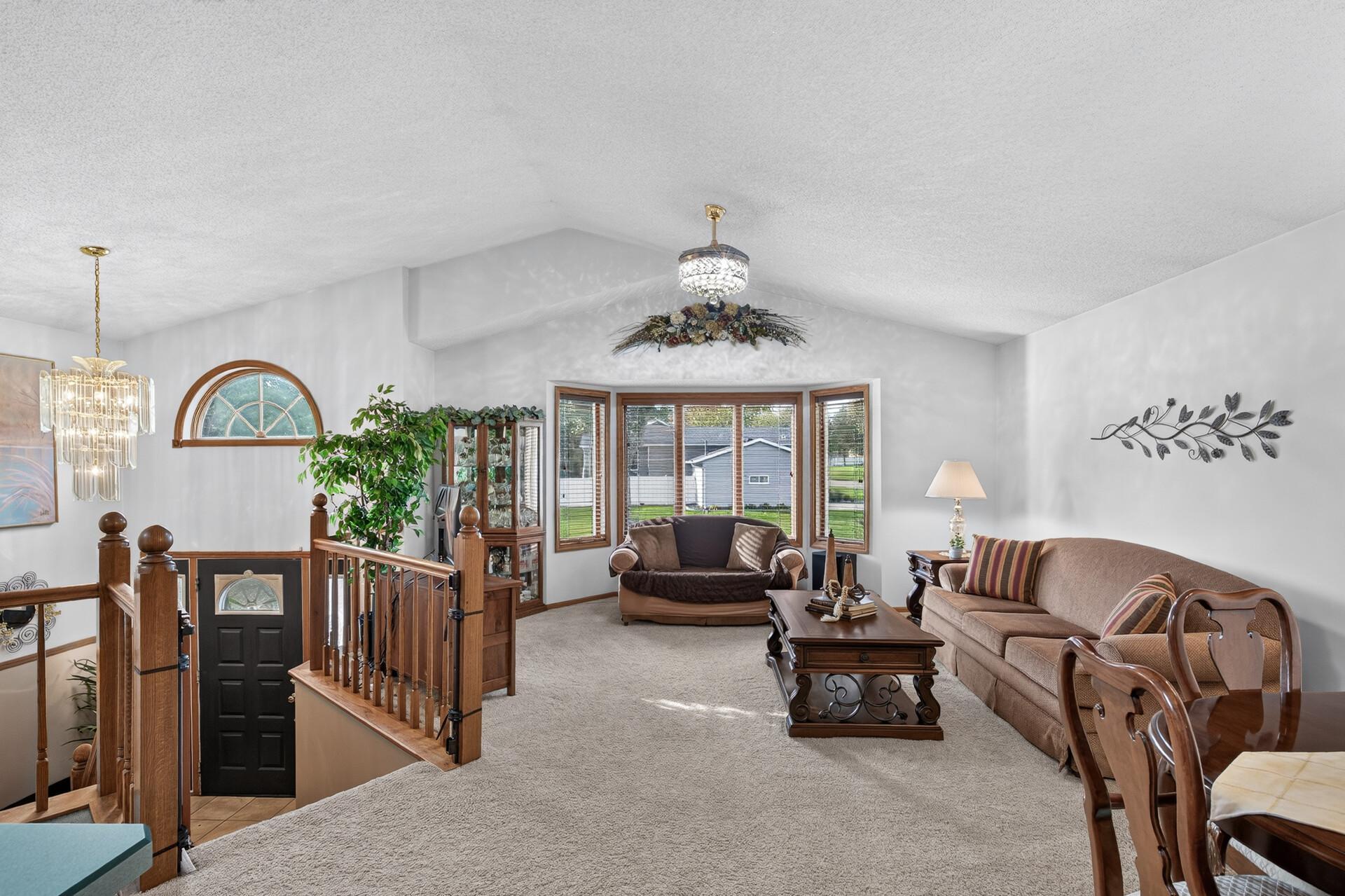 Main floor vaulted ceilings help create a large inclusive living space