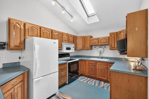 Flooring & cabinet updates do wonders! Lots of nice cabinets and good working space.