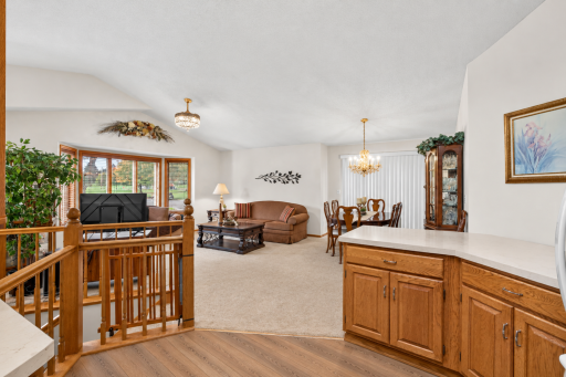 Vaulted ceiling and open floor plan is perfect for gatherings. Ai inspired flooring and countertops