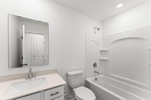 This full-sized bathroom is near the secondary bedrooms and features a single vanity and shower-tub combination.