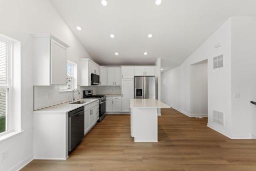 Designer-selected cabinetry throughout the kitchen offers ample storage room for dishware and daily culinary essentials