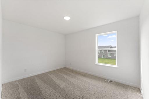 The secondary bedrooms offer peace and quiet after a busy day.