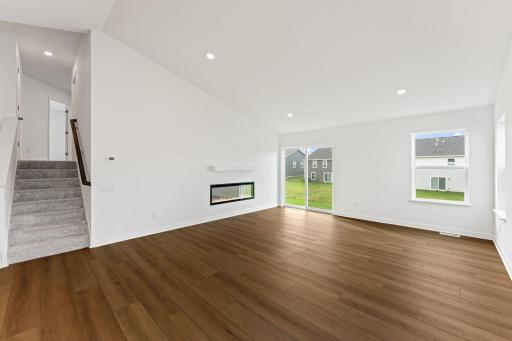 Airy and inviting, the Great Room is ideal for watching movies with the family and hosting special celebrations with guests. Open the adjacent glass-sliders to invite a refreshing breeze throughout the home.