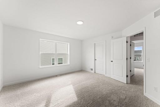 The bedroom has direct access to the private bathroom and closet