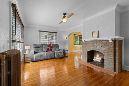 Refinished hardwood floors welcome you into the bright and inviting living room.