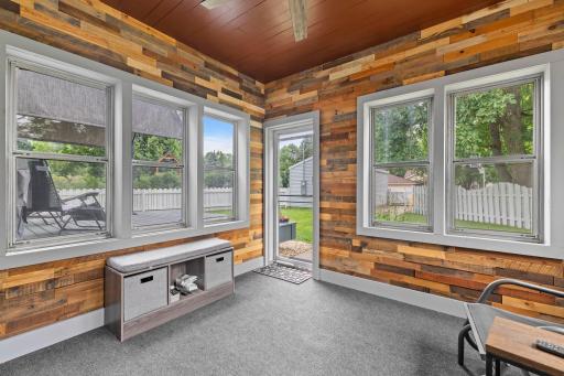 Beautiful wood walls, a ceiling fan, and plenty of room to enjoy everything from quiet mornings with coffee to evenings with guests.