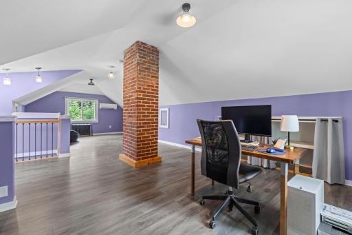 Upstairs, the spacious loft has been completely refreshed with LVP flooring.