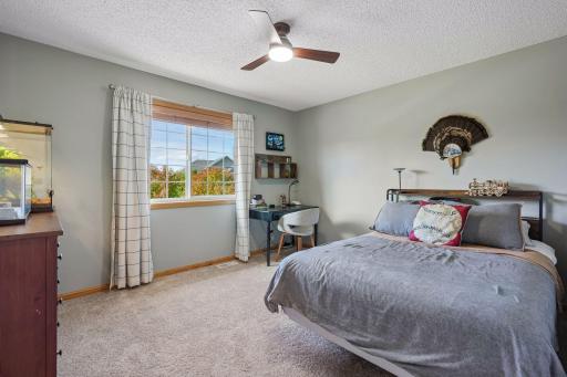 Third bedroom on the upper level with views of the backyard