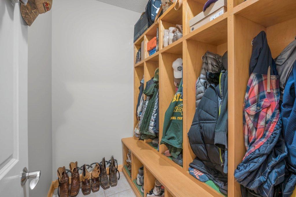 Main floor mud room with built in storage and bench.
