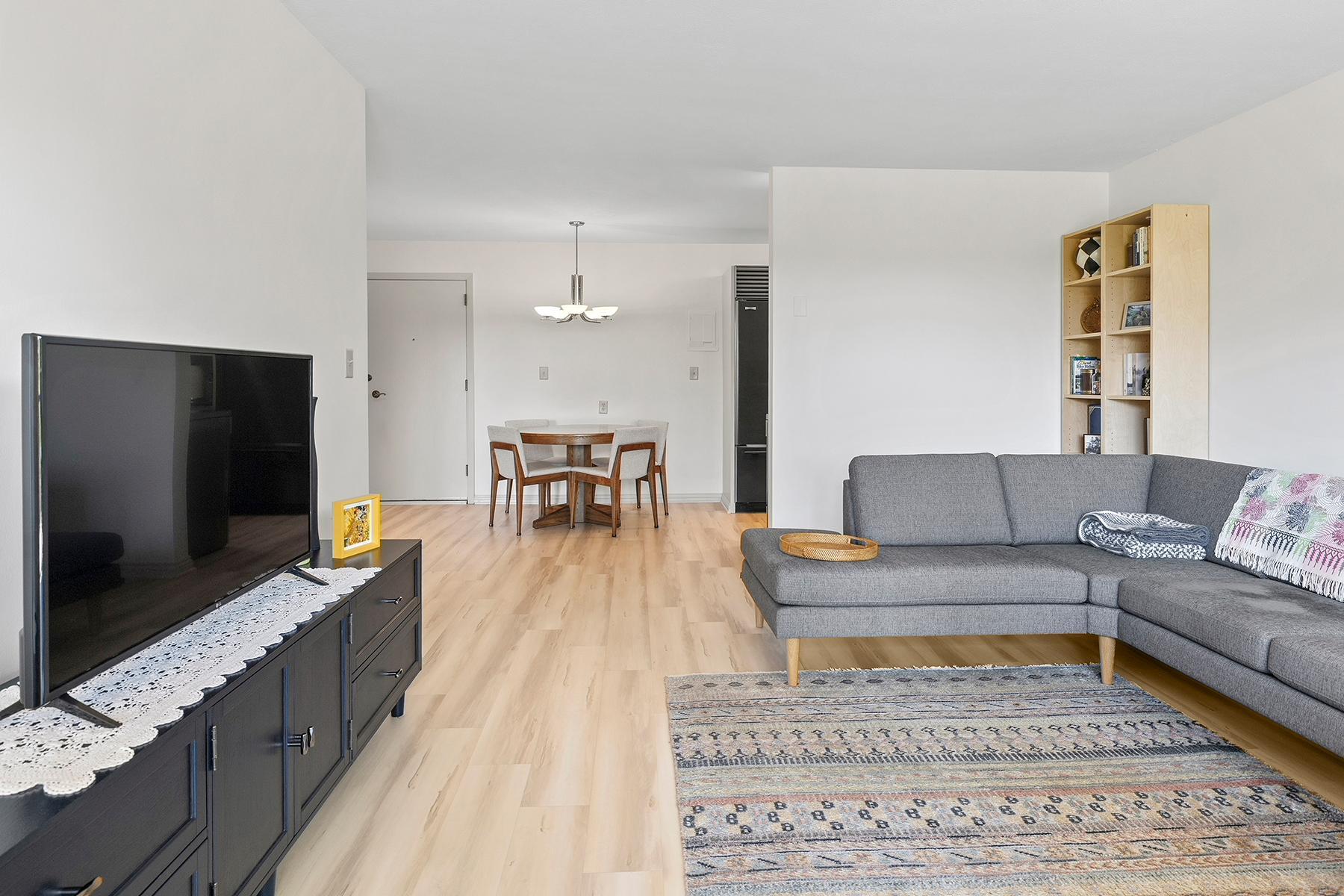 Natural light pours in from the living room patio doors.