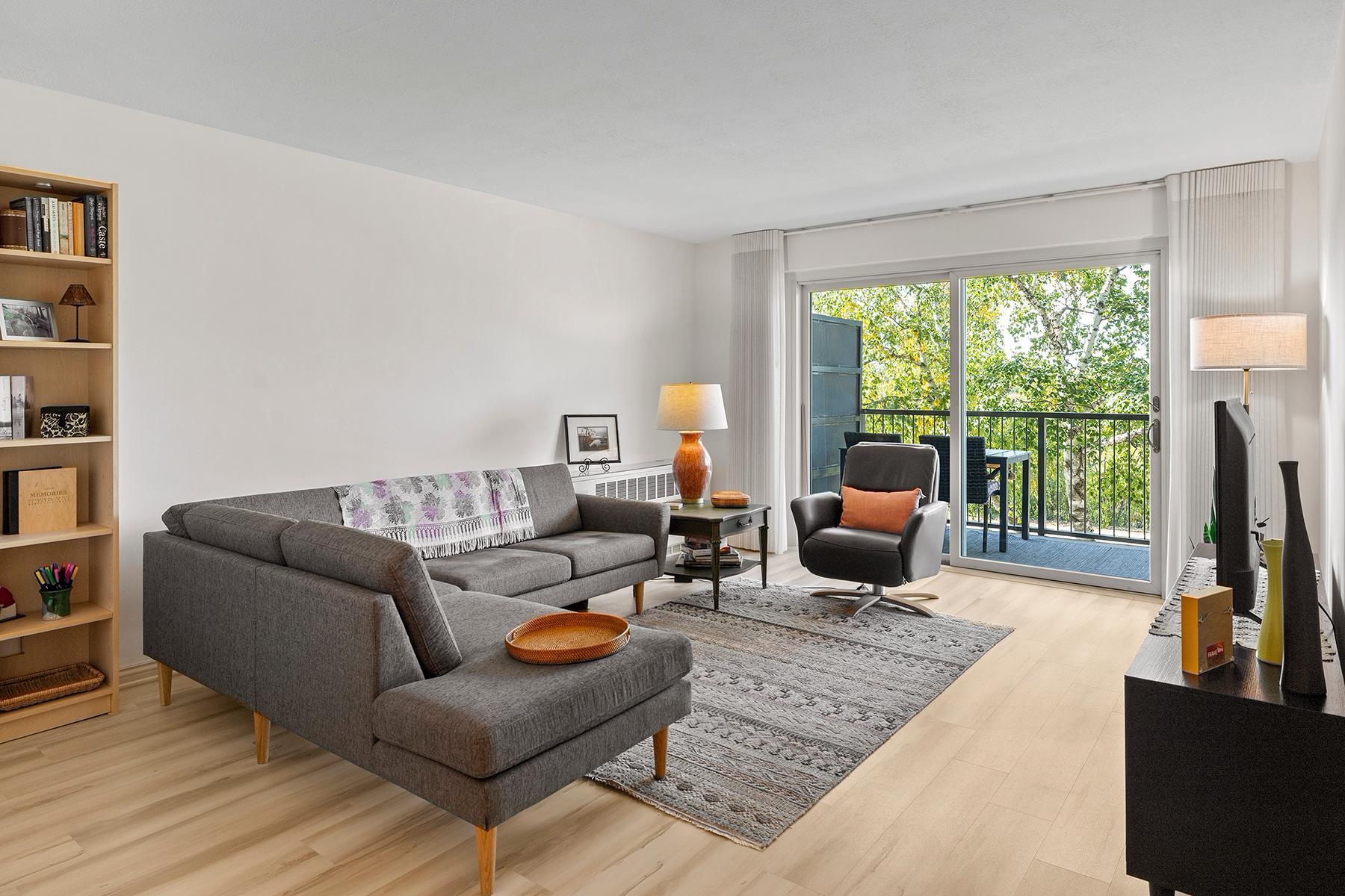 Living room features Scandinavian-style LVP flooring (new in past 5 years) and freshly painted walls (2026).
