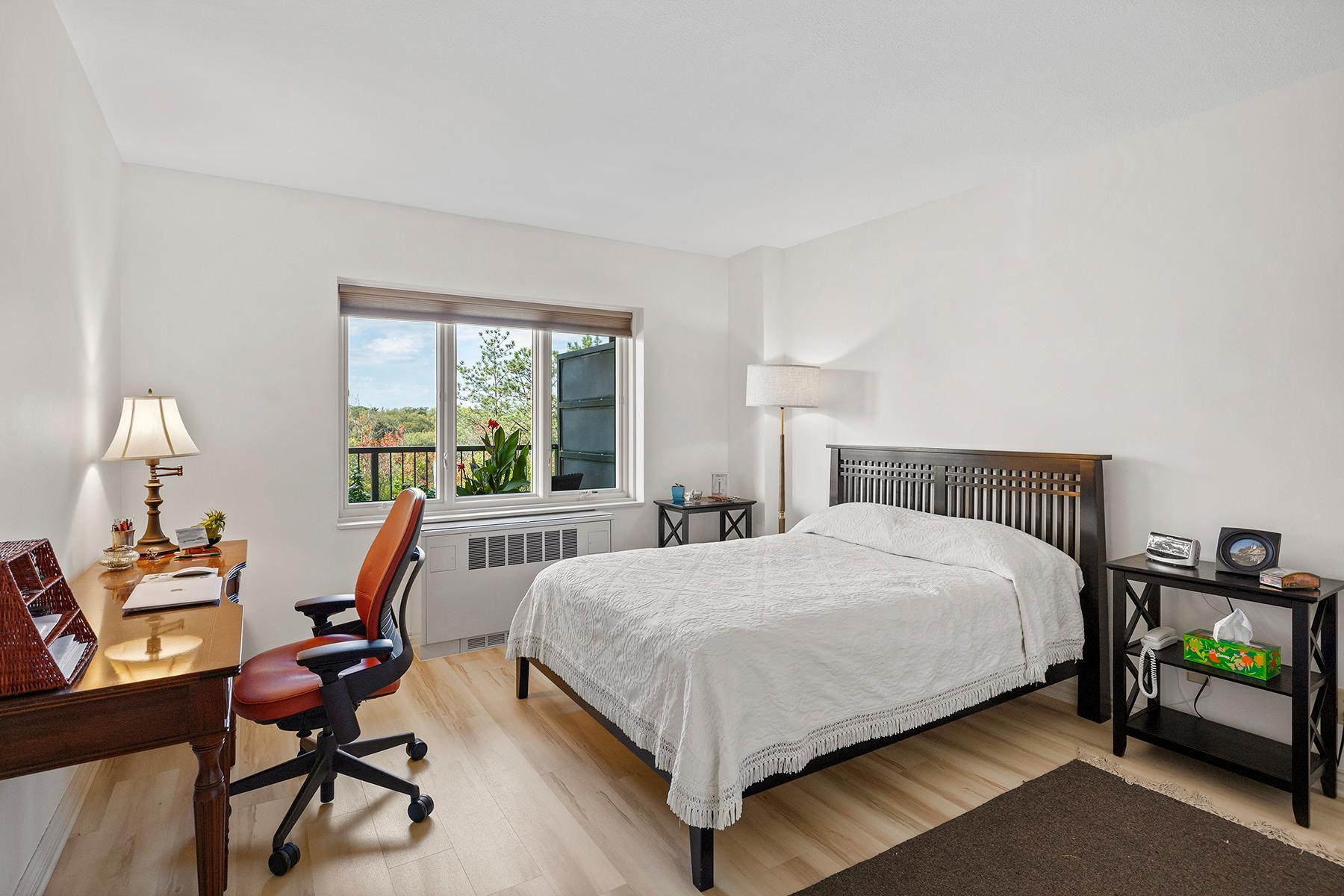 Large bedroom with west treetop view.